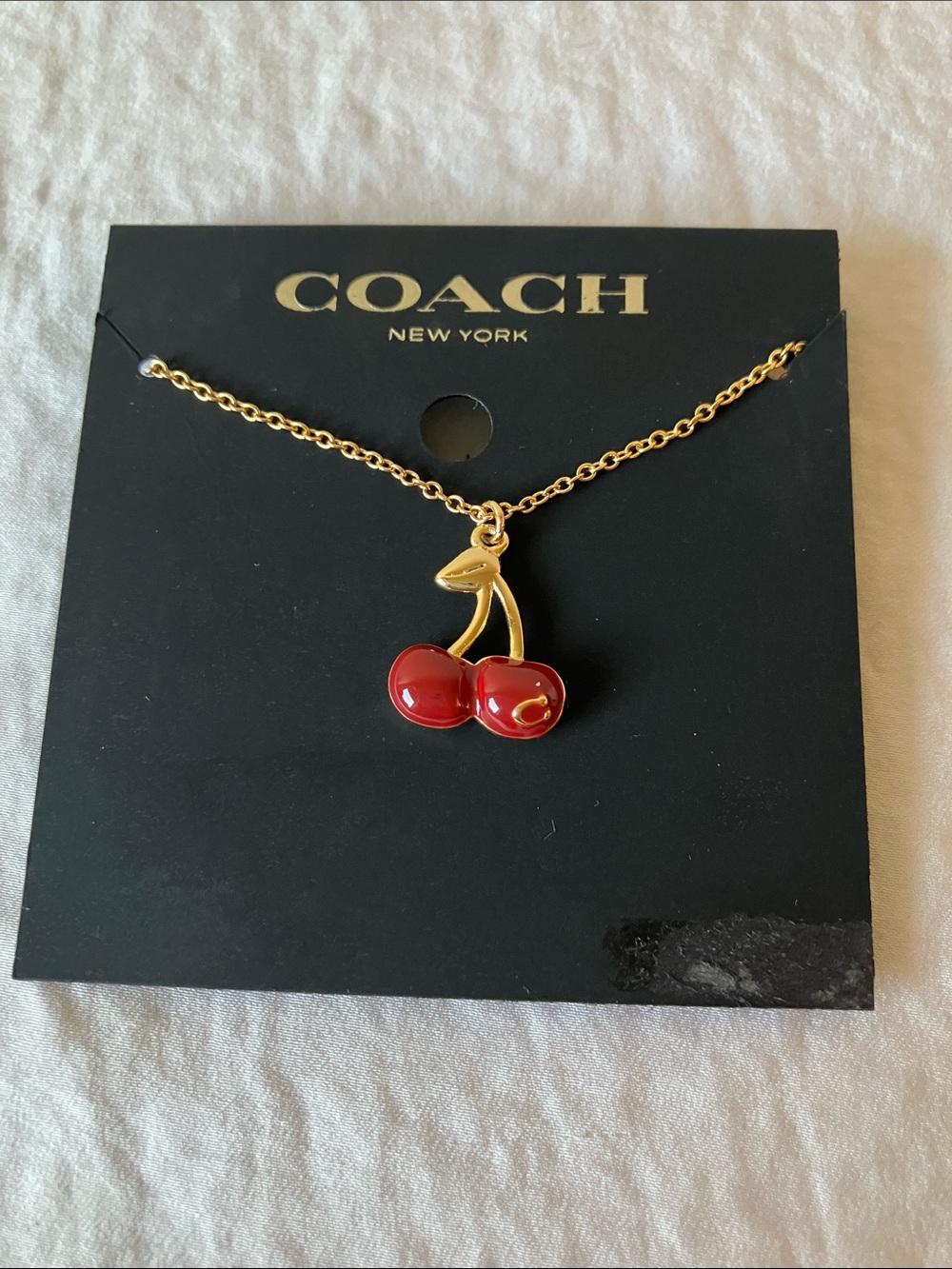 Coach: Gold-Tone Cherry Pendant Slider Bracelet